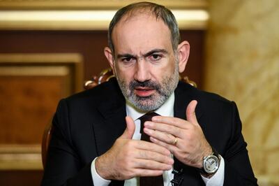 (FILES) In this file photo taken on October 6, 2020 Armenian Prime Minister Nikol Pashinyan gives an interview to AFP in Yerevan. Armenian Prime Minister Nikol Pashinyan said on November 10, 2020 he had signed a "painful" agreement with Azerbaijan and Russia to end the war over the disputed region of Nagorno-Karabakh. / AFP / -
