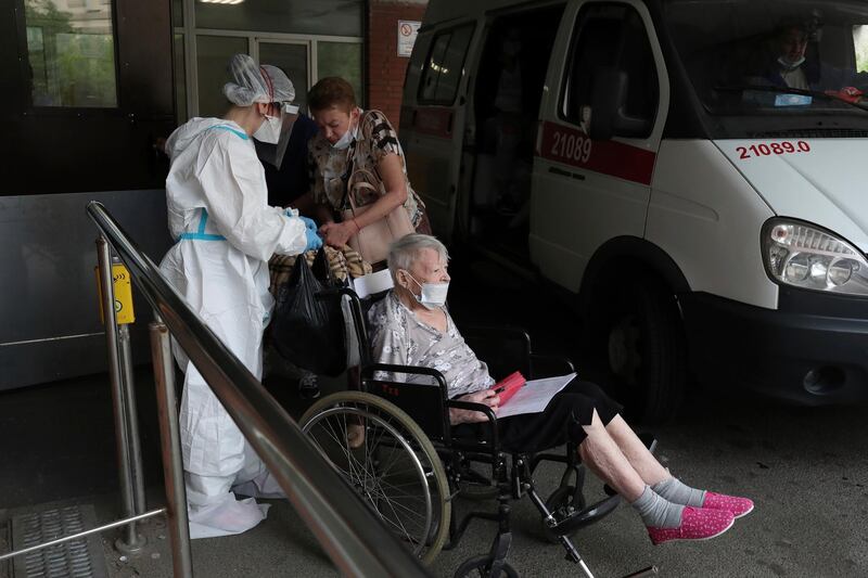 Medical workers transport a patient suspected of having coronavirus at a hospital in St Petersburg, Russia. AP