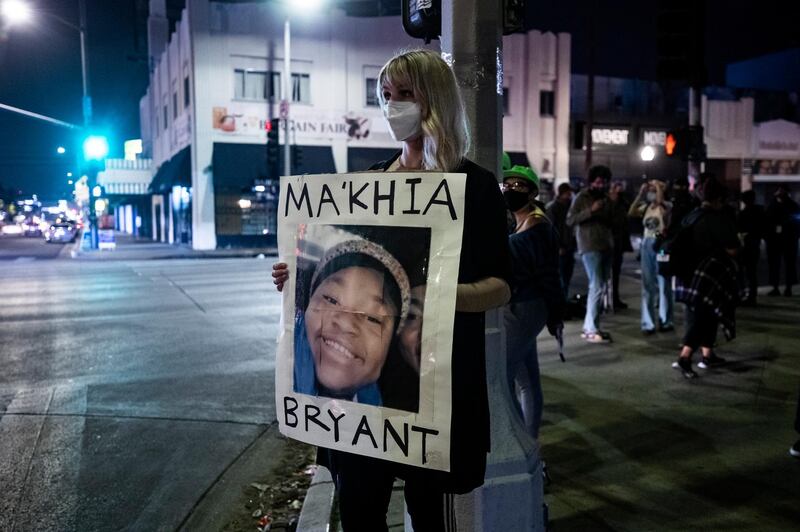 A protester holds a poster displaying the portrait of Ma'Khia Bryant as people gathered to the news that former Minneapolis police officer Derek Chauvin was found guilty of all three charges in the murder of George Floyd in Los Angeles, Californi. EPA