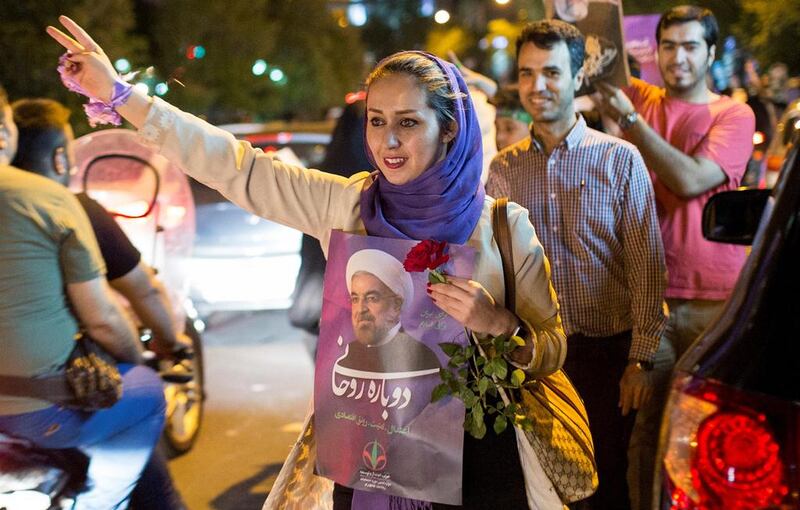 A supporter of Iranian president Hassan Rouhani during an election campaign rally in Tehran, one of the 24 million people who voted for him. Tima / Reuters