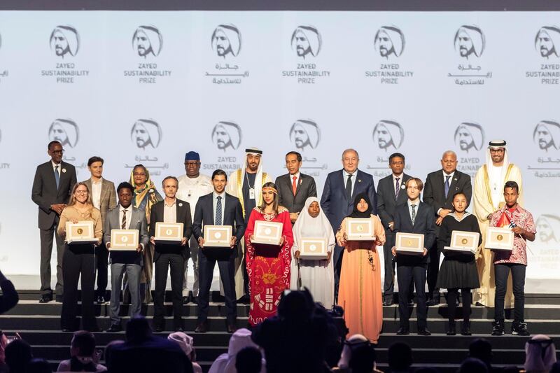 ABU DHABI, UNITED ARAB EMIRATES. 13 JANUARY 2020. The Zayed Sustainability Awards held at ADNEC as part of Abu Dhabi Sustainability Week. The winners from Top row center is H.E. Sheikh Mohammed bin Zayed Al Nahyan, Crown Prince of Abu Dhabi and Deputy Supreme Commander of the United Arab Emirates Armed Forces. LtoR in the bottom row: Health Winner: Globhe, Sweden. Food Winner: Okuafu Foundation, Ghana. Energy Winner: Electricians Without Borders, France. Water Winner: Ceres Imaging, USA. Global High Schools Winner: The Americas, Air Batalla, Columbia. Global High Schools Winner: Sub Sahara Africa, HakimiAliyu Day Secondary School, Nigeria. Global High Schools Winner: Middle East and North Africa, Al Amal Junior High School, Morocco. Global High Schools Winner: Europe and Central Asia, United World College Mostar, Bosnia and Herzegovina. Global High Schools Winner: South Asia, Bloom Nepal School, Nepal. Global High Schools Winner: East Asia and Pacific, Eutan Tarawa IETA Junior Secondary School, Kiribati. (Photo: Antonie Robertson/The National) Journalist: Kelly Clarker. Section: National.

