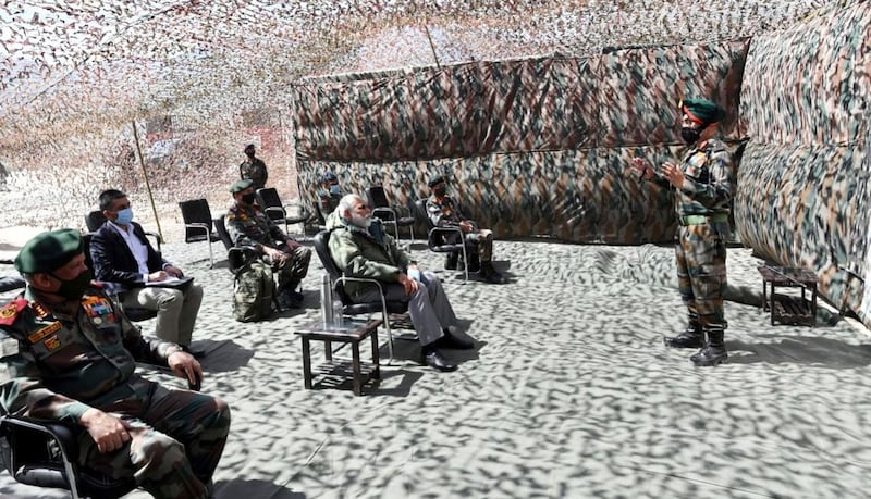 Narendra Modi and top Indian army officials listen to a briefing in Leh.  EPA