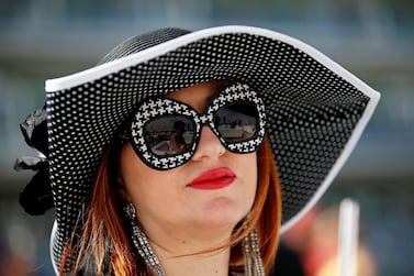 epa07472779 A racegoer attends the Dubai World Cup 2019 at the Meydan race course in the Gulf emirate of Dubai, United Arab Emirates, 30 March 2019. The Dubai World Cup is one of the highest endowed events in the horse racing calendar. EPA/ALI HAIDER