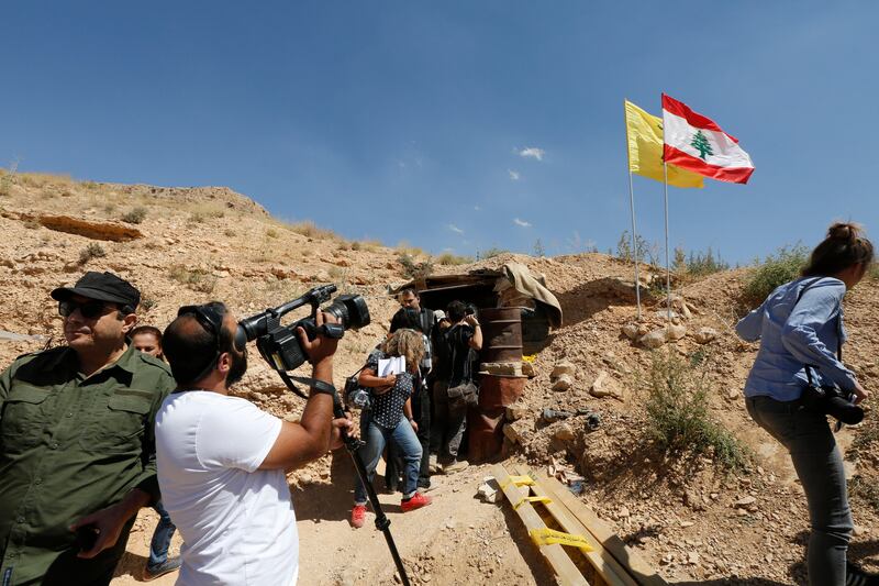 Lebanese and foreign media are seen in front the entrance of big cave of Al-Nusra terrorism groups in a mountainous area in Juroud of Arsal at the Lebanese -Syrian border. Nabil Mounzer.