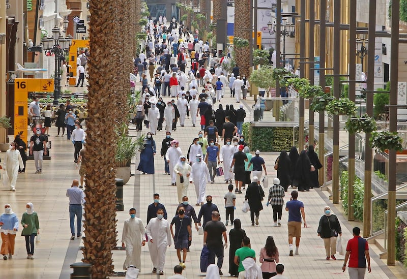 Kuwaiti residents walk inside the reopened Avenues Mall, the country's largest shopping centre, in Kuwait City. AFP