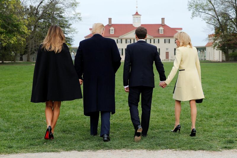 US President Donald Trump and first lady Melania Trump and French President Emmanuel Macron and Brigitte Macron walk to pose for a picture on a visit to the estate of the first US President George Washington in Mount Vernon, Virginia outside Washington, US, on April 23, 2018. Jonathan Ernst / Reuters