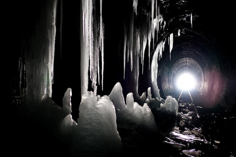 A view of icicles in the narrow-gauge railway tunnel in Szklary, south-eastern Poland. The 602-metre long tunnel resembles an ice cave with stalactites and stalagmites. Darek Delmanowicz / EPA