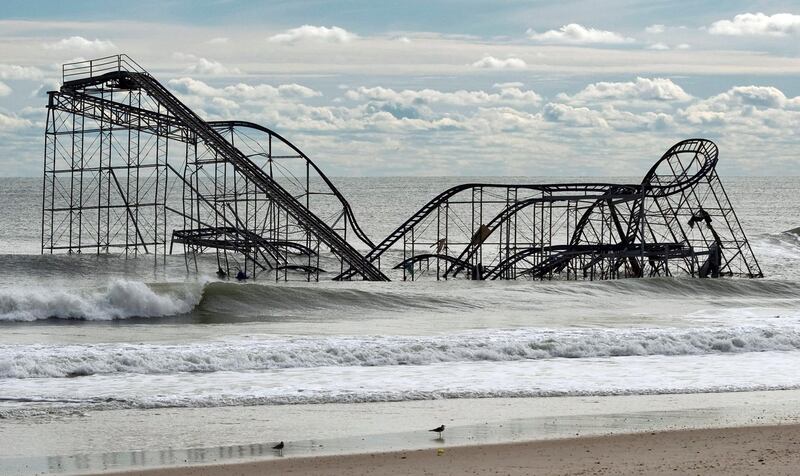 The remnants of a roller coaster sits in the surf three days after Hurricane Sandy came ashore in Seaside Heights, New Jersey November 1, 2012. At least 82 people in North America died in the superstorm, which ravaged the northeastern United States on Monday night, and officials said the count could climb higher as rescuers searched house-to-house through coastal towns.  REUTERS/Steve Nesius  (UNITED STATES - Tags: ENVIRONMENT DISASTER TPX IMAGES OF THE DAY)
