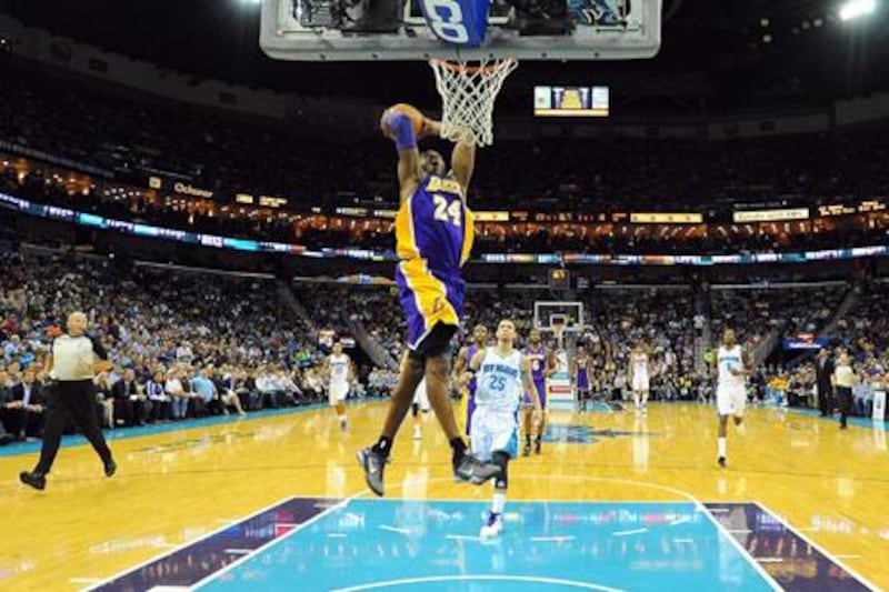 Los Angeles Lakers' Kobe Bryant dunks against New Orleans Hornets, having broken through the 30,000 points barrier.