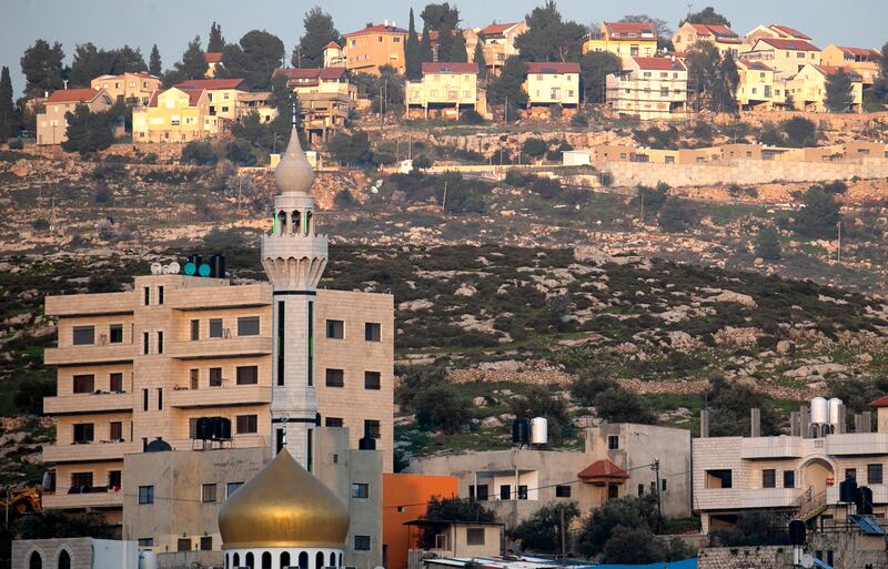 The Palestinian village of Azmut, east of Nablus, in the occupied West Bank, with the Israeli settlement of Alon Moreh in the background. AFP