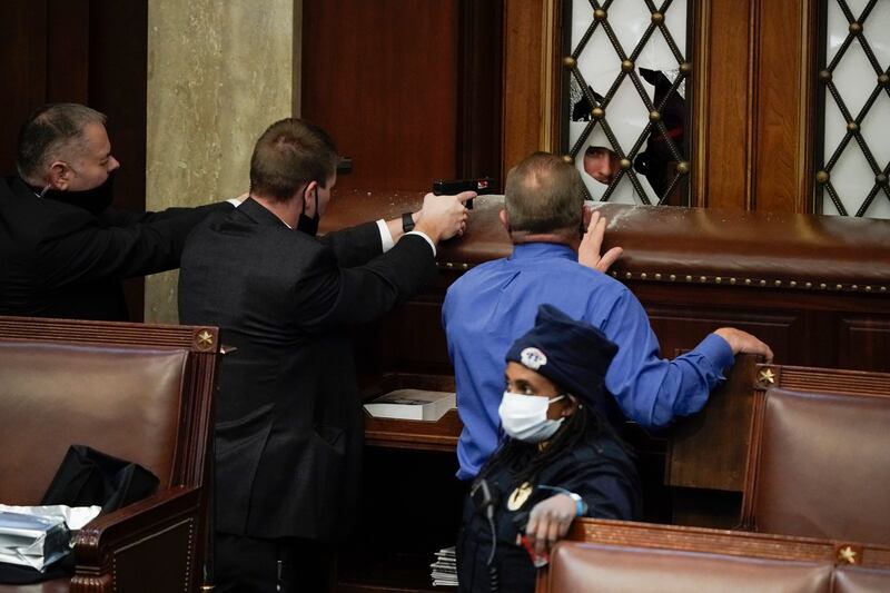 US Capitol police prevent rioters from breaking into the House chamber at the US Capitol on January 6, 2021. AP