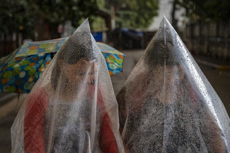 Residents use plastic bags to shield themselves from ash mixed with rainwater as Taal Volcano erupts in Talisay, Batangas province, Philippines. Local authorities have begun evacuating residents near Taal Volcano as it began spewing ash up to a kilometre high Sunday afternoon. The Philippine Institute of Volcanology and Seismology has raised the alert level to three out of five, warning of the volcano's continued "magmatic unrest." Getty Images