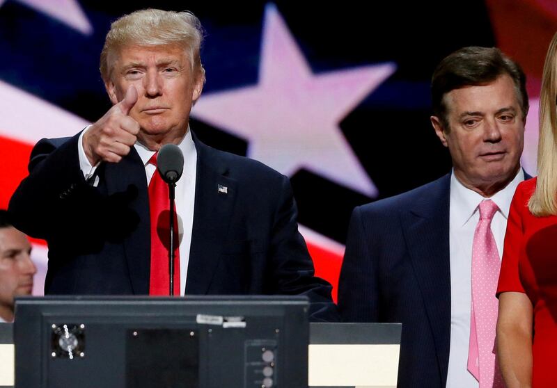 FILE PHOTO: Republican presidential nominee Donald Trump gives a thumbs up as his campaign manager Paul Manafort looks on during Trump's walk through at the Republican National Convention in Cleveland, U.S., July 21, 2016. REUTERS/Rick Wilking/File Photo