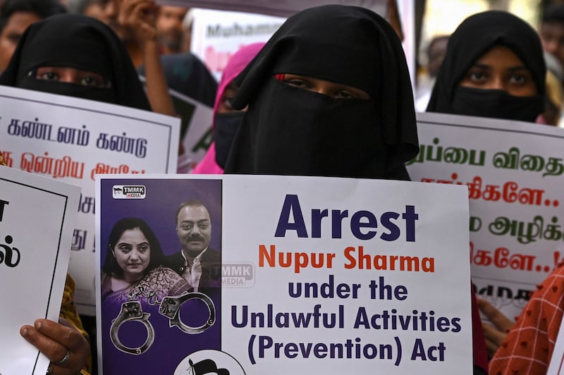 Activists from the Tamilnadu Muslim Munnetra Kazhagam hold placards during a protest in Chennai. AFP