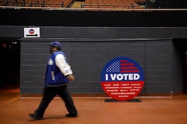 A man walks past a large replica 'I Voted' sticker at an early voting station in Inglewood, California, for the 2020 presidential election. Bloomberg