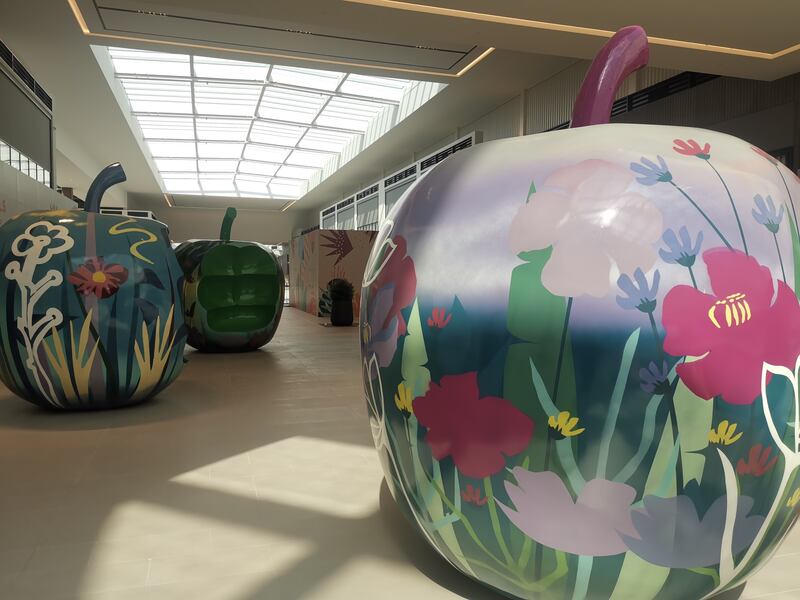 Apple-shaped seats for children near Adventure Park.