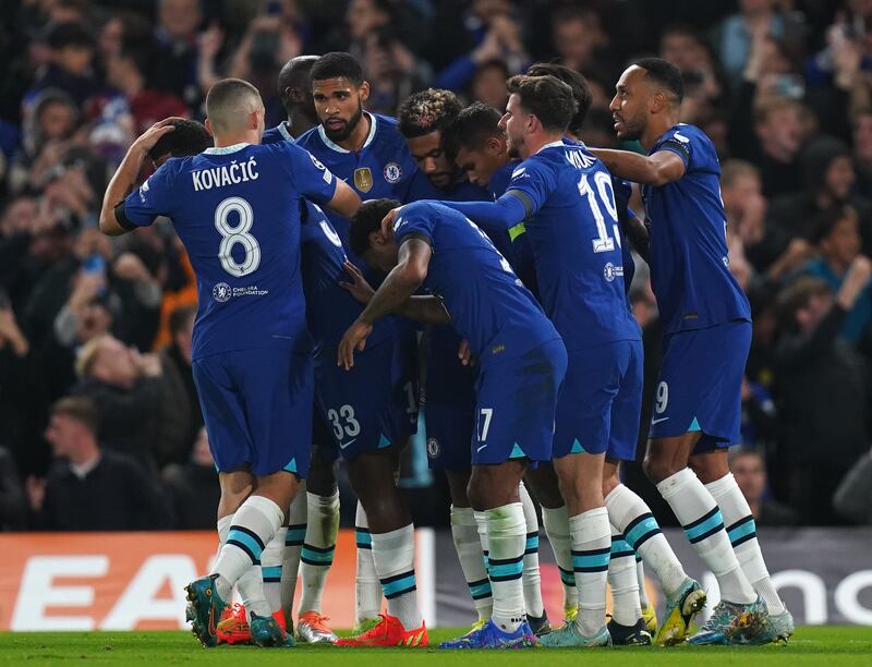 Chelsea's Wesley Fofana is mobbed by teammates after scoring. PA