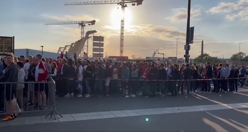 Fans waiting outside the gates to enter the stadium. PA