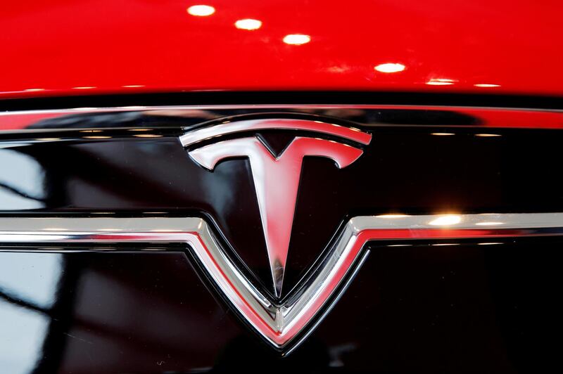 FILE PHOTO: A Tesla logo on a Model S is photographed inside of a Tesla dealership in New York, U.S., April 29, 2016. REUTERS/Lucas Jackson/File Photo
