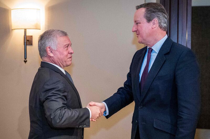 Jordan's King Abdullah receiving UK Foreign Secretary Lord Cameron in Amman. AFP