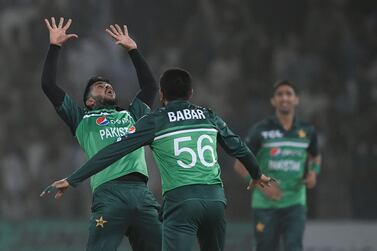 Pakistan's Hasan Ali (L) celebrates after taking the wicket of West Indies' Shai Hope (unseen) during the third and final one-day international (ODI) cricket match between Pakistan and West Indies at the Multan International Cricket Stadium in Multan on June 12, 2022.  (Photo by Aamir QURESHI  /  AFP)