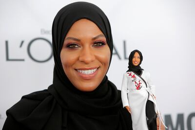 Olympic fencer Ibtihaj Muhammad holds a Barbie doll made in her likeness as she attends the 2017 Glamour Women of the Year Awards at the Kings Theater in Brooklyn, New York, U.S., November 13, 2017.  REUTERS/Andrew Kelly