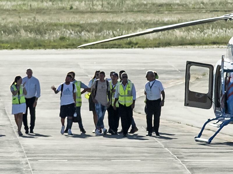 Argentina's Lionel Messi and Angel Di Maria about to board a helicopter. AFP