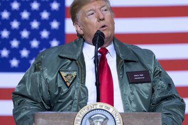 US President Donald Trump speaks to US military during an unannounced trip to Al Asad Air Base in Iraq. Saul Loeb / AFP