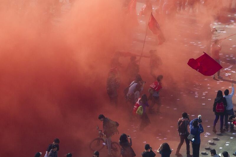 Chilean students march in front of La Moneda presidential Palace during a protest against the government’s education reform, in Santiago. Claudio Reyes / AFP 