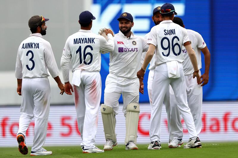 India celebrate the dismissal of Australia's Nathan Lyon, who was out for 13. AFP