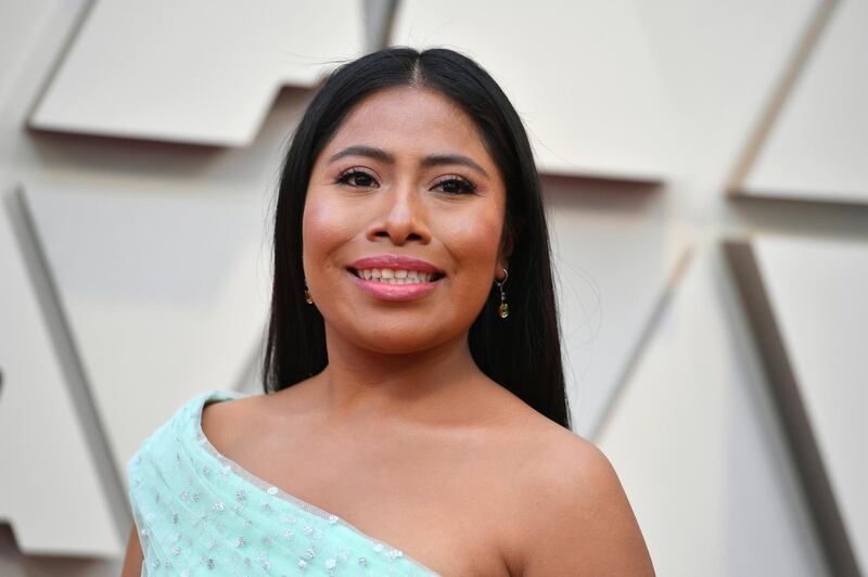 FILE - In a Sunday, Feb. 24, 2019 file photo, Yalitza Aparicio arrives at the Oscars, at the Dolby Theatre in Los Angeles. Television personality Yeka Rosales for the Mexican-based Televisa network is facing strong criticism after dressing up in "brownface" and wearing a prosthetic nose to make fun of indigenous Mexican actress Yalitza Aparicio.  (Photo by Jordan Strauss/Invision/AP, File)