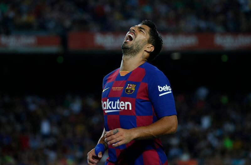 It wasn't all smiles for Suarez against Arsenal. AP Photo