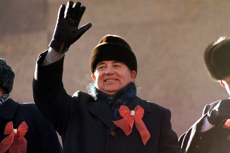 Gorbachev waves from the Red Square in November 1987, during celebrations to mark the 70th anniversary of the Russian Revolution. AP