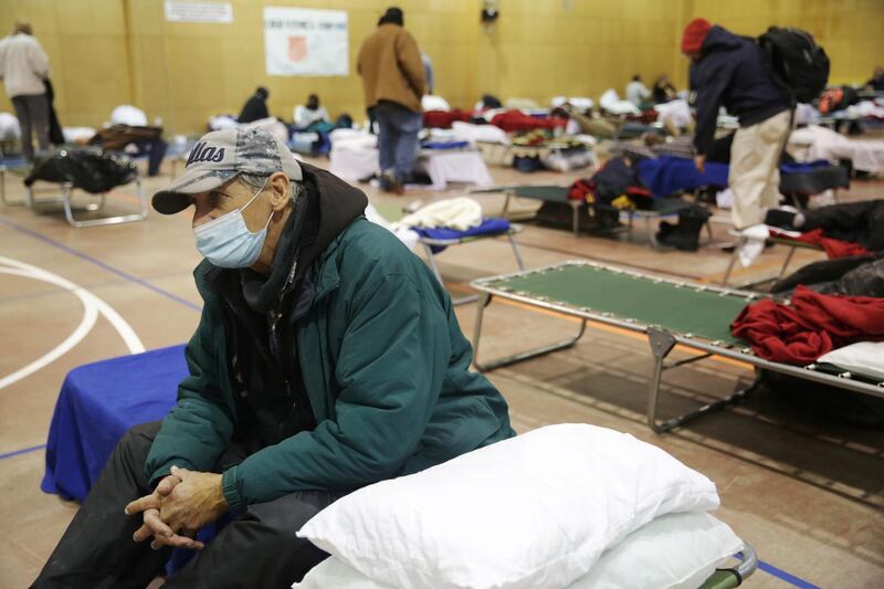 Sid Snow, 72, stays overnight at a Salvation Army centre after winter weather caused power cuts in Plano, Texas. He made a four-hour trip to visit his son in the north of the state, but the hotel where he was staying lost power. Reuters