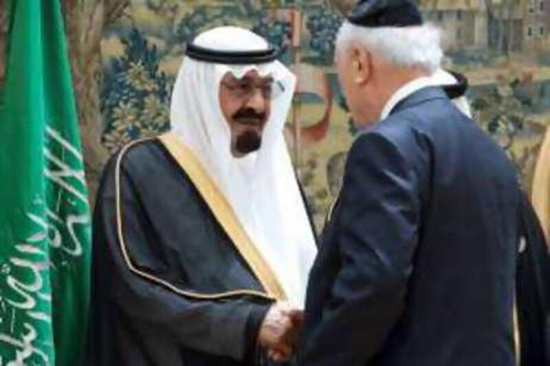 King Abdullah of Saudi Arabia, left, meets Rabbi Arthur Schneier of the Park East Synagogue of New York City during the World Conference on Dialogue last July in Madrid.