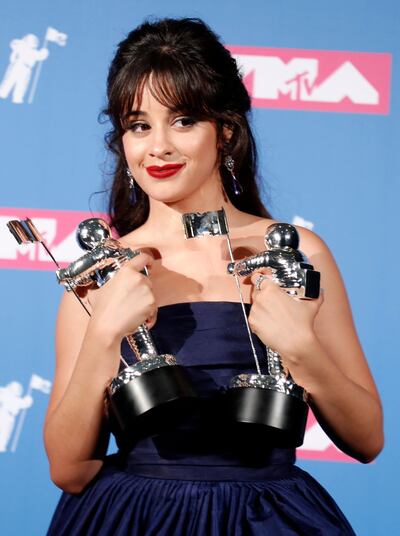 2018 MTV Video Music Awards - Photo Room - Radio City Music Hall, New York, U.S., August 20, 2018. - Camila Cabello poses backstage with her awards for Artist of the Year and Video of the Year for "Havana." REUTERS/Carlo Allegri