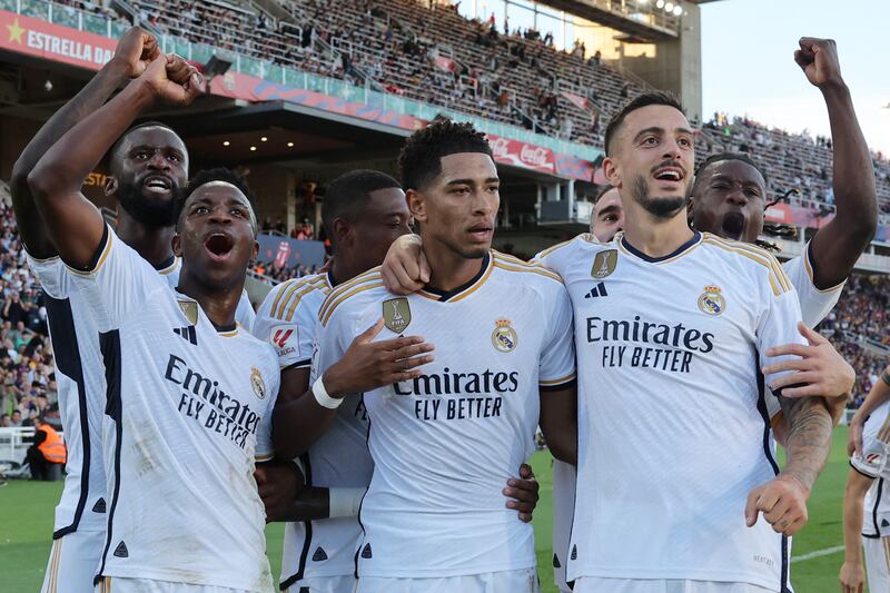 Real Madrid's Jude Bellingham, centre, celebrates with Antonio Rudiger, Vinicius Junior and Joselu after scoring his team's second goal. AFP