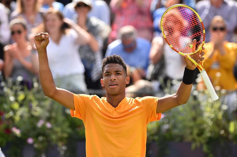 Canada's Felix Auger Aliassime celebrates his win over Greece's Stefanos Tsitsipas in their men's singles quarter final tennis match at the ATP Fever-Tree Championships tournament at Queen's Club in west London on June 21, 2019.  / AFP / Glyn KIRK                          
