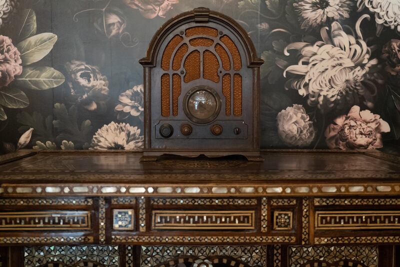 A hand-carved Syrian table and antique radio in Pistachio’s majlis-style dining room. Sophie Tremblay / The National