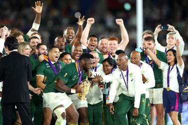 YOKOHAMA, JAPAN - NOVEMBER 02: Players of South Africa celebrate as Siya Kolisi of South Africa lifts the Web Ellis Cup following their victory against England in the Rugby World Cup 2019 Final between England and South Africa at International Stadium Yokohama on November 02, 2019 in Yokohama, Kanagawa, Japan. (Photo by Hannah Peters/Getty Images)