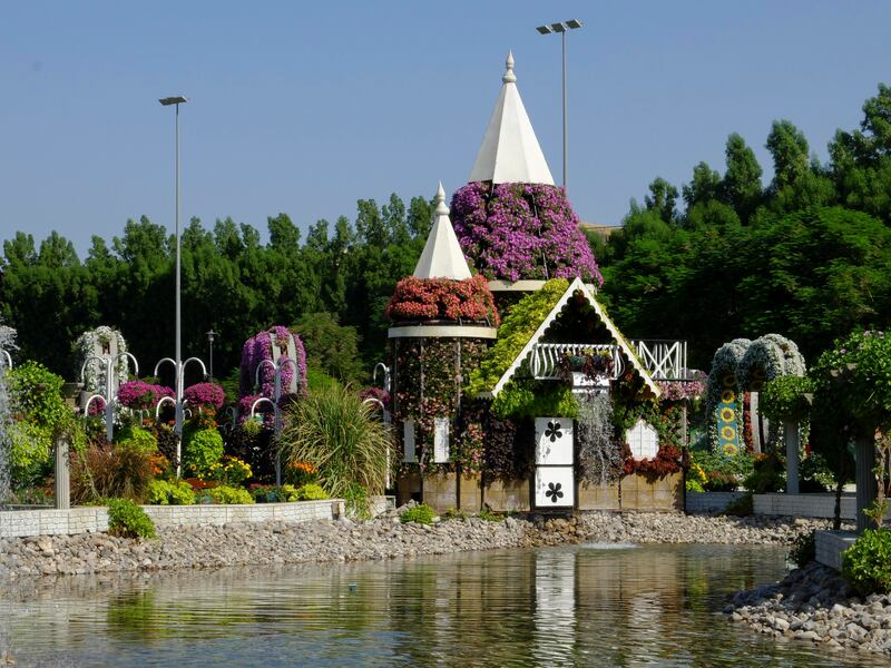 A floral house on a lake water feature. 