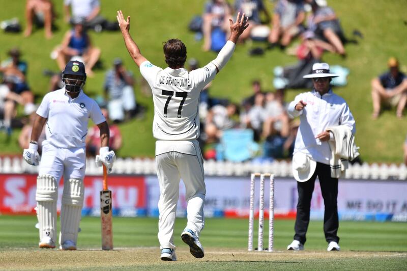 New Zealand's Colin de Grandhomme (C) celebrates India's Ishant Sharma being out LBW. AFP