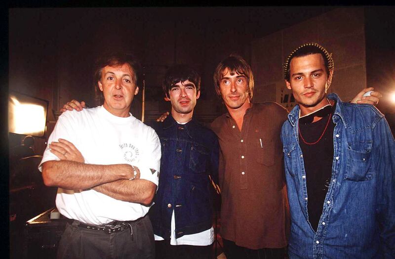 Johnny Depp, right, with Paul McCartney, Noel Gallagher and Paul Weller at a recording of the 'Help Album' as aid for Bosnia at Abbey Road Studios in London in 1995. Getty Images