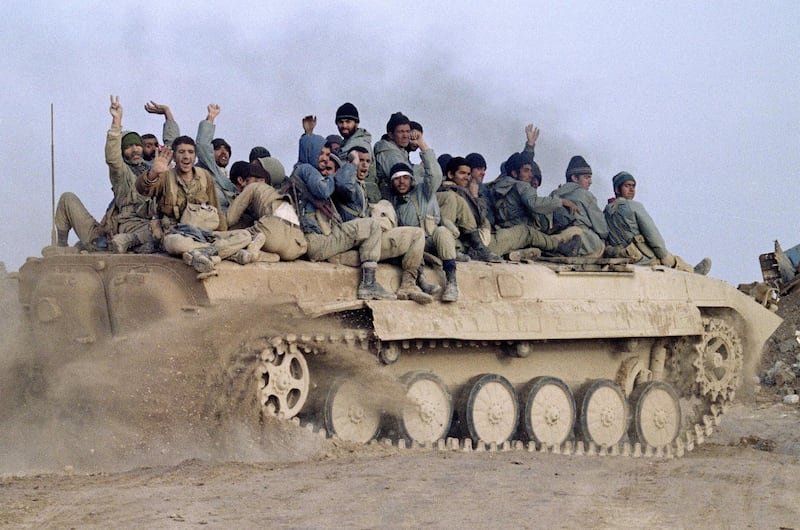 Iranian revolutionary guards celebrate their victory over Iraqi troops in Iraq's Bovarian Island, near Basra, on January 23, 1987. AFP