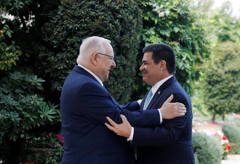 Israeli President Reuven Rivlin embraces Paraguayan President Horacio Cartes upon his arrival for a meeting at his residence in Jerusalem, ahead of the dedication ceremony of the embassy of Paraguay in Jerusalem, May 21, 2018. REUTERS/Ronen Zvulun