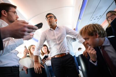 UK Prime Minister Rishi Sunak onboard a plane bound for San Diego on Sunday. Getty Images