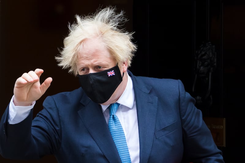 British Prime Minister Boris Johnson leaves No 10 Downing Street for Prime Minister’s Questions at Parliament in London.