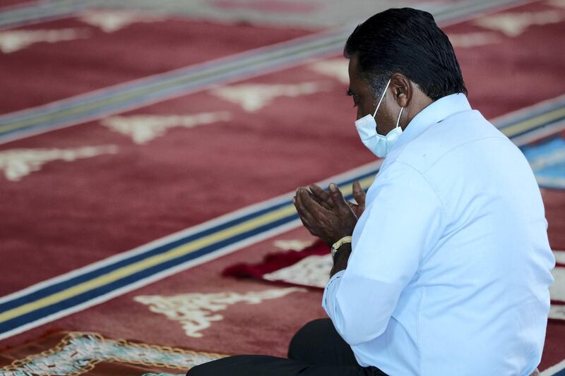 Dubai, United Arab Emirates - December 03, 2020: People pray at Al Farooq Omar Bin Al Khattab Mosque. Thursday, December 3rd, 2020 in Dubai. Chris Whiteoak / The National