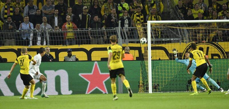 Borussia Dortmund’s Andre Schurrle, left, scores the equaliser against Real Madrid. Martin Meissner / AP Photo