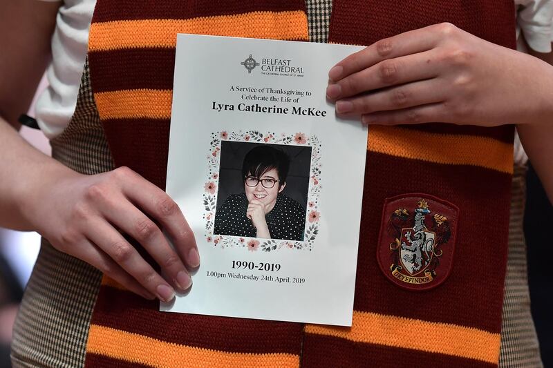 A mourner wearing a Hogwarts scarf holds the order of service for the funeral for journalist Lyra McKee at St Annes Cathedral. Getty Images